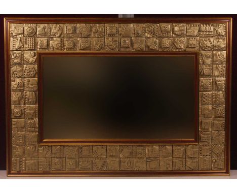 Ron Hitchins (b.1926) - Abstract relief framed wall mirror, the tiled inset frame with varying designed gilt-sprayed raised g