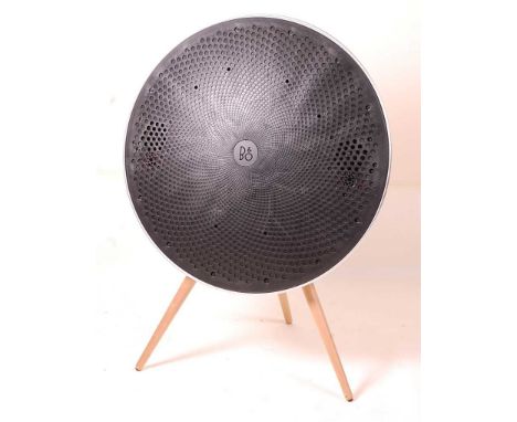 Bang &amp; Olufsen - a BeoPlay A9 freestanding speaker, of circular slightly convex form, raised on three turned and tapering