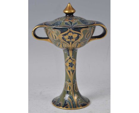 A Moorcroft Florian ware Yellow Poppy pattern twin handled chalice and cover, early 20th century, underglaze painted and tube