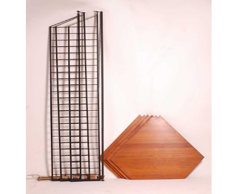 A 1960s Ladderax corner display shelf, having three black painted metal laddered sections, four teak deep adjustable corner s