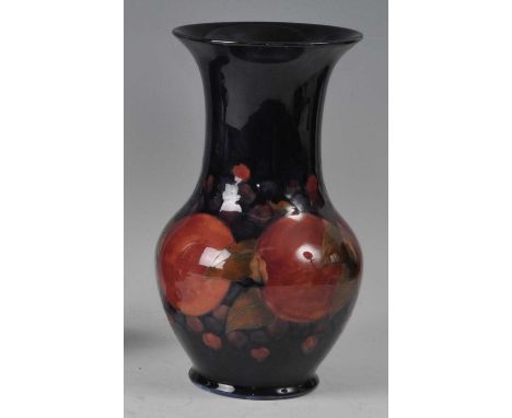 A Moorcroft Pomegranate pattern pottery vase, of lower bulbous form, underglaze painted and tube-line decorated, impressed ma