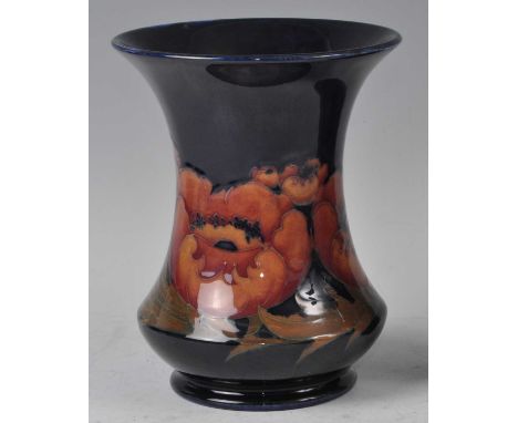 A Moorcroft Big Poppy pattern pottery vase, of waisted form to cylindrical foot, underglaze painted and tube-line decorated, 