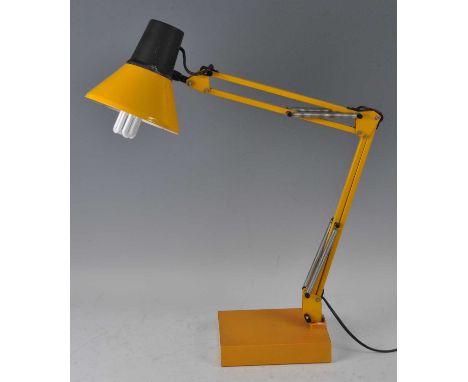 A 1960s yellow painted anglepoise style desk lamp, having typical hinged adjustable action, raised on integral polypropylene 