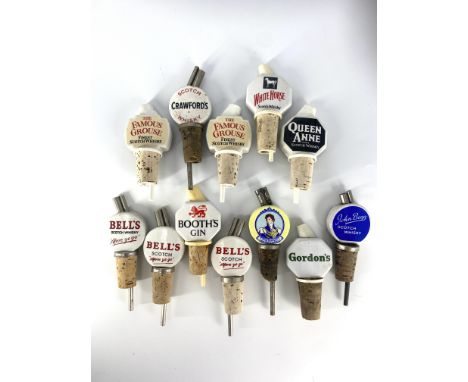 A large collection of ceramic pourers, 12 in total