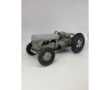 A Fergir tractor metal model, 11 inches x 4 inches