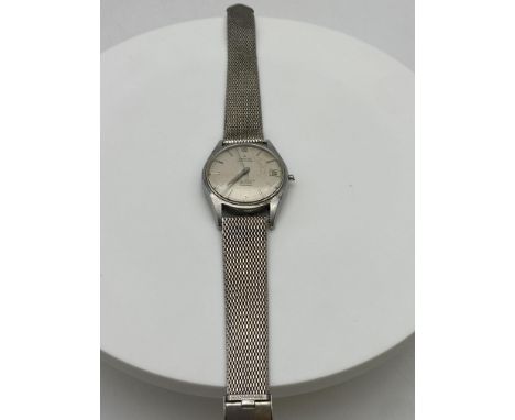 A vintage stainless steel Zenith watch, working automatic watch, winder is broken
