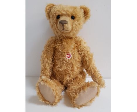 STEIFF TEDDY BEAR in blond mohair, limited edition number 00619, with chest tag, button to ear and black and white tag to sid