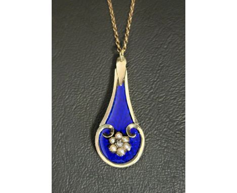 ENAMEL, SEED PEARL AND DIAMOND PENDANTthe central diamond and seed pearl cluster on a deep blue guilloche enamel panel, in un