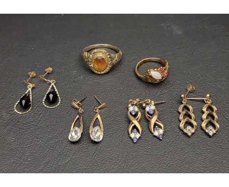 SELECTION OF GOLD PLATED JEWELLERYcomprising an opal and ruby set ring; a foil backed faceted glass set ring; and four pairs 