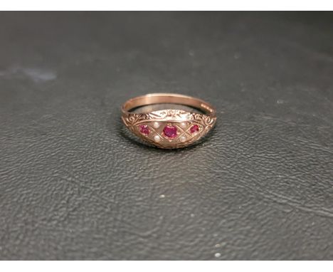 RUBY AND SEED PEARL CLUSTER RING the three round cut rubies interspersed with four seed pearls surrounded by engraved decorat