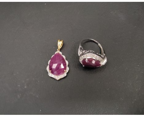 RUBY SET PENDANT AND RINGboth set with rose cut pear shaped rubies, the ring in silver and size O, the pendant in silver and 
