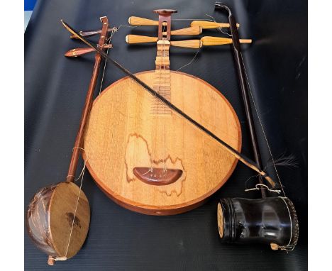 SELECTION OF MUSICAL INSTRUMENTScomprising a Chinese yueqin moon lute, Chinese erhu and a Thai saw u with bow 