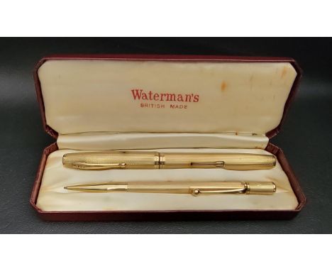 WATERMAN'S NINE CARAT GOLD PEN AND PENCIL SETthe side filling fountain pen with fourteen carat gold nib, together with a retr