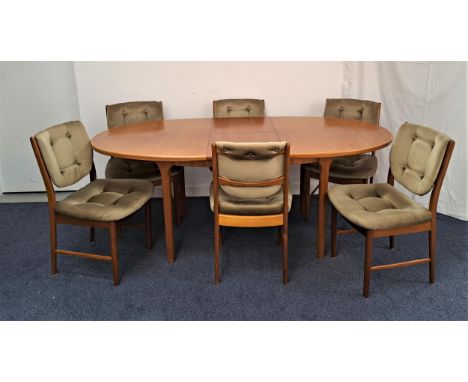 MCINTOSH OVAL TEAK DINING TABLE AND SET OF TEAK CHAIRSthe table with a pull apart top and fold out leaf, standing on tapering