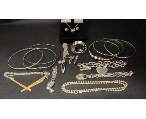 SELECTION OF SILVER AND OTHER JEWELLERYincluding a curb link silver bracelet with heart tag; silver bangles; a CZ set silver 