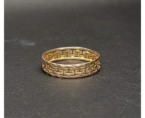 FOURTEEN CARAT GOLD BANDthe pierced meander design between two thin textured bands, approximately 1.1 grams, ring size R 