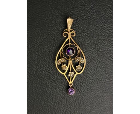 NINE CARAT GOLD HOLBEIN PENDANT the central bezel set amethyst surrounded by seed pearls in a floral design with a further be