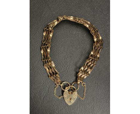 NINE CARAT GOLD GATE BRACELETwith nine carat gold padlock clasp and safety chain, approximately 9.3 grams 