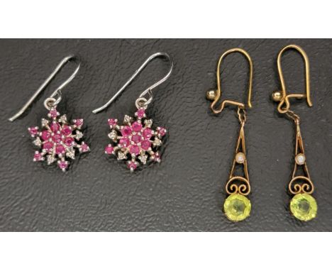PAIR OF EDWARDIAN PERIDOT AND SEED PEARL DROP EARRINGSin nine carat gold; together with a pair of ruby and diamond cluster ea