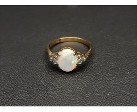 OPAL AND MARCASITE RINGthe central opal flanked by three marcasites to each side, on eighteen carat gold shank marked 'MAPPIN