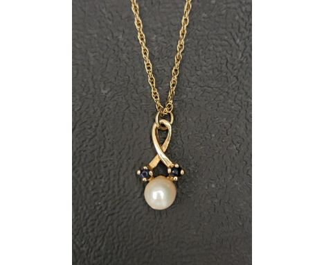 PRETTY SAPPHIRE AND PEARL PENDANT the central pearl flanked by two sapphires, set in nine carat gold and on a nine carat gold