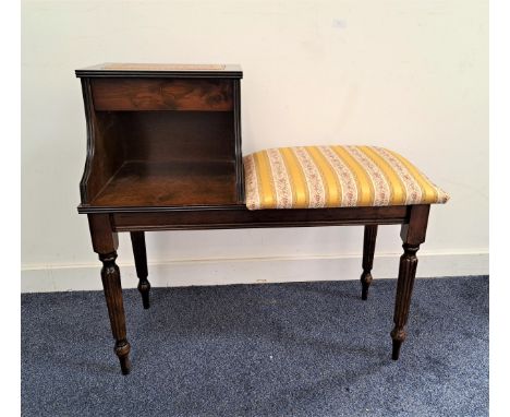 MAHOGANY TELEPHONE SEATwith an inset top above a drawer with a shelf below and a padded seat to the side, standing on turned 