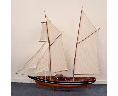 SCALE MODEL OF LA BELLE POULEa French twin mast frigate, of wood construction with stand, 197cm long 