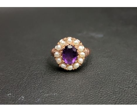 AMYTHYST AND PEARL CLUSTER RINGthe central oval cut amethyst approximately 1ct in a twelve pearl surround, on nine carat rose