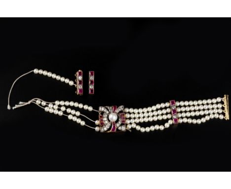 A DIAMOND, SYNTHETIC RUBY AND CULTURED PEARL BRACELET, centred with a rectangular openwork panel with channels of graduated s