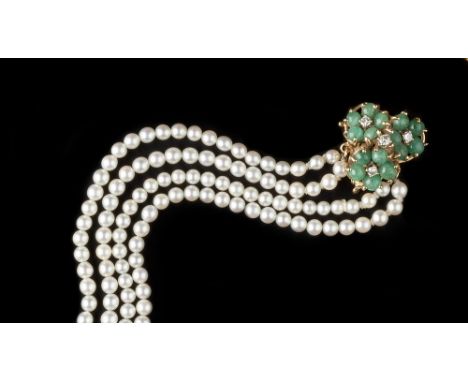 A CULTURED PEARL BRACELET WITH GEM SET CLASP, comprising four strands of uniform cultured pearls, to a triple cluster clasp o