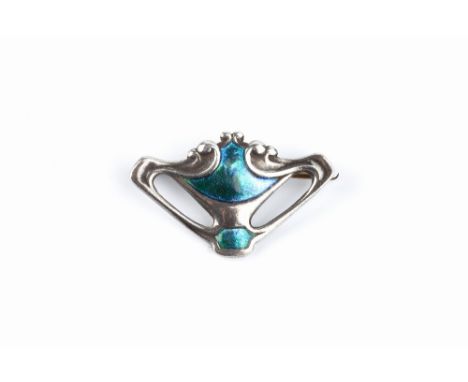 A COLLECTION OF ARTS AND CRAFTS BROOCHES, comprising a silver and enamel panel brooch by Charles Horner, of shaped triangular