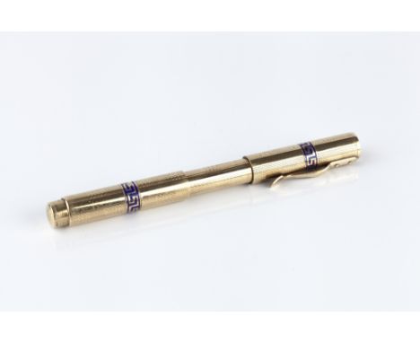 A 9CT GOLD FOUNTAIN PEN, the engine turned expand and retract body with two bands of blue enamel greek key decoration, 10.5cm