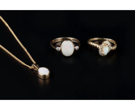 A COLLECTION OF OPAL JEWELLERY, comprising an opal and diamond three stone ring, the oval cabochon opal collet set between ro