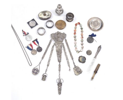 A LATE 19TH CENTURY PIERCE-DECORATED CHATELAINE, hung with various accessories including scissors in case, aide memoire, and 