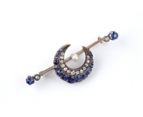 A LATE VICTORIAN SAPPHIRE, DIAMOND AND PEARL CRESCENT BAR BROOCH, centred with a double row crescent moon of graduated cushio