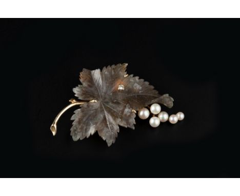 A MOSS AGATE, DIAMOND AND CULTURED PEARL BROOCH, the moss agate panel naturalistically modelled as a leaf, highlighted by a r