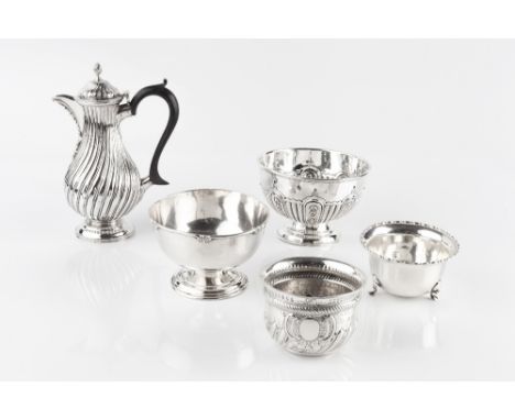 A LATE VICTORIAN SILVER SMALL HOT MILK POT, of wrythen baluster form, with ebonised handle by Charles Stuart Harris, London 1