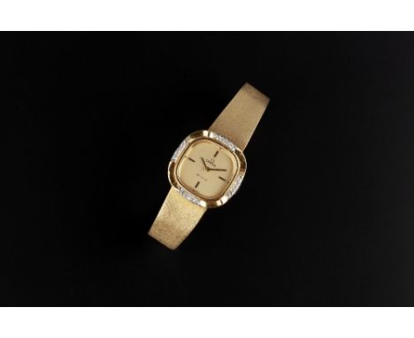 A LADY'S DIAMOND SET 'DE VILLE' BRACELET WATCH BY OMEGA, the cushion-shaped dial with baton quarters, to a fluted bezel highl