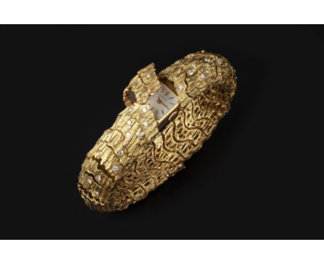 A LADY'S DIAMOND SET BRACELET WATCH RETAILED BY TIFFANY &amp; CO, the square silvered dial with gilt baton markers, signed Ti