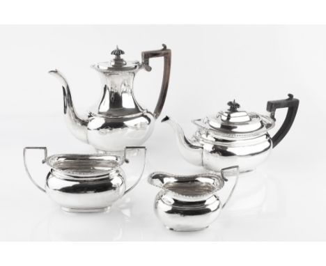 A LATE VICTORIAN SILVER FOUR PIECE TEA AND COFFEE SERVICE, with gadrooned borders, the tea and coffee pots with ebonised hand