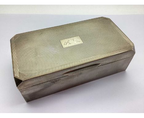 A Hallmarked Silver Rectangular Cigarette Box, Sheffield 1933, of rectangular form, the engine turned hinged lid with canted 