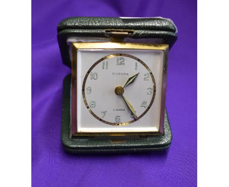 A lighter and alarm clock in an engraved box presented to a Manchester United player following Manchester United's first ever