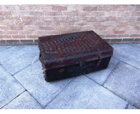 A CROCODILE SKIN TRUNK 35cm high, 82cm wide and 56cm deep 