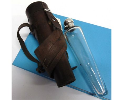 A CONICAL GLASS FLASK with plated top and contained in a leather holder for saddle mounting, 22cms high