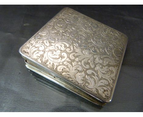 Continental hallmarked silver (925) compact. The front highly decorated with engineered floral scrolls. Total approx weight -