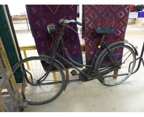 Vintage ladies road bike with lamp on front. Makers mark rubbed