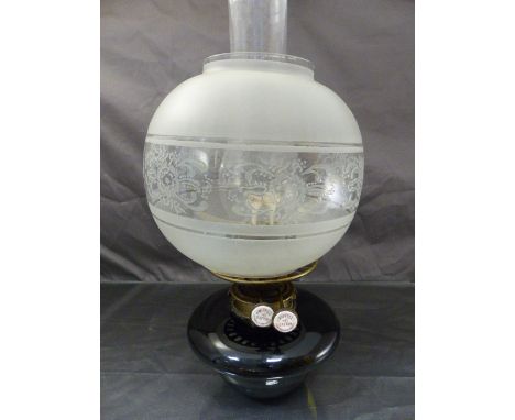 Oil lamp by J Wippell & Co Exeter with chimney and shade