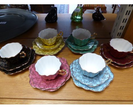 A Royal Stuart multi coloured six part tea service with gilt decoration by Spencer Stevenson England.