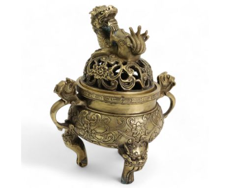 Chinese polished bronze incense burner and cover, pierced domed cover with temple lion finial, the base cast with scrolling f