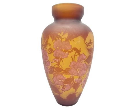 Art Nouveau style glass vase, in the style of Galle, the tapering body decorated with trailing red and pink foliage on a yell